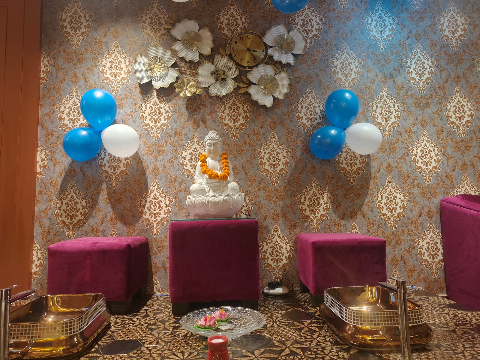 Ornate carved gold wall panel in the spa lounge